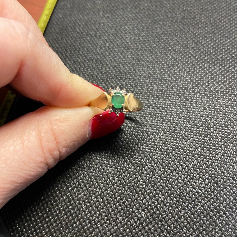 Yellow gold emerald and diamond accent ring